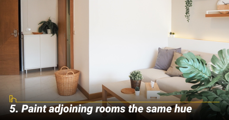 Paint adjoining rooms the same hue
